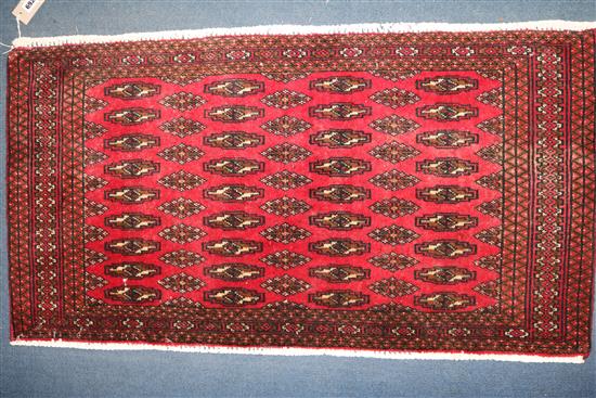 A Turkoman small red ground rug, 3ft 8in by 2ft.